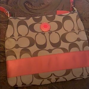 Signature brown trim in orange coach bag